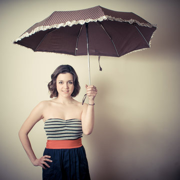 vintage portrait of young woman with umbrella
