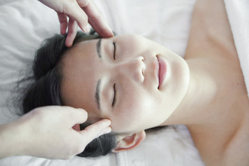 Fototapeta na wymiar Woman Receiving Head Massage