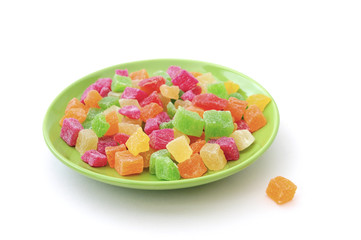 candied fruit on a plate isolated