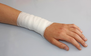 bandaged arm of a child because of a skin lesion