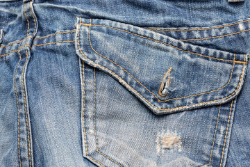 Rear pocket of Blue Jeans