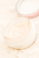 Obraz na płótnie Canvas Cosmetic cream in jar close up angle