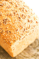 Loaf of bread on wooden table top view