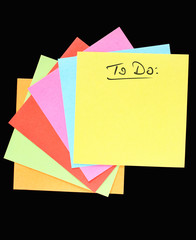 TO DO list concept: a colorful fan of paper notes