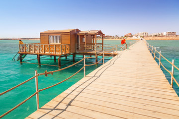 Wooden pier with change room house on Red Sea in Egypt