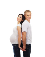 Fototapeta premium A young couple: pregnant mother and a happy father