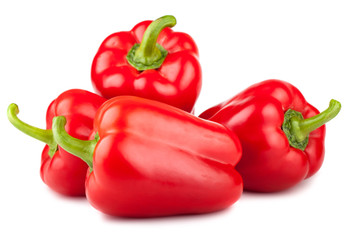 Four red sweet peppers