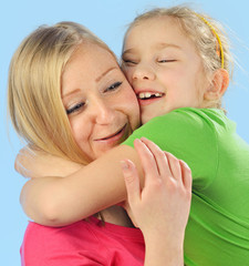 Young mother and her daughter. Happy and smiling family.