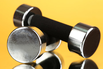 Dumbbells at 2 kg on yellow background
