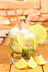 Glass of cocktail with lime and mint