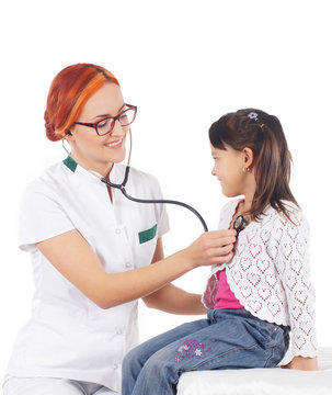 Attractive young doctor and the little girl isolated on white