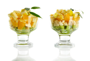 Fruit salad in a sundae dish isolated on white