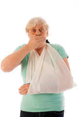 Old woman with broken wrist in gypsum