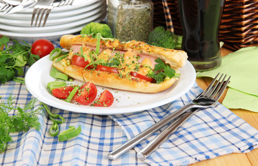 Delicious hot dog on plate at picnic close-up