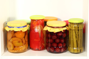Different conservations on white shelf