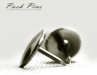 Close up shot of two push pins