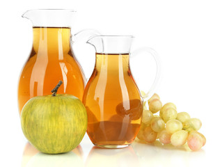 Apple juice in pitchers isolated on white