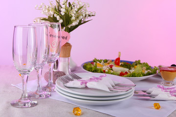 Table setting on yellow background