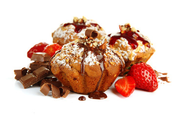 Tasty muffin cakes with strawberries and chocolate, isolated