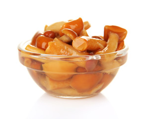 Mushrooms in glass bowl, isolated on white