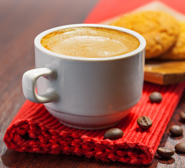 Coffee cup and cookies on a table