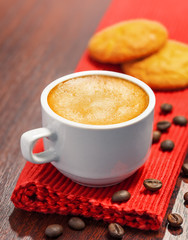 Coffee cup and cookies on a table