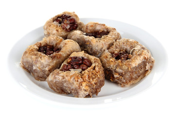 Sweet baklava on plate isolated on white