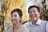 Happy Mature Couple Enjoying the Park in Autumn
