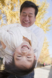 Grandfather and Granddaughter Playing in the Park