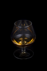 Pouring cognac into a Glass.