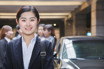 Portrait of Young businesswoman in parking garage 