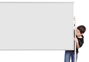 Portrait of happy little boy with white blank board