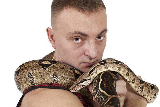 Portrait of man with boa snake
