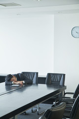 Businessman sleeping in office room