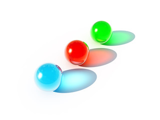 three bright balls of different colors on a white background