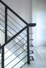 staircase with metallic handrails in modern interior