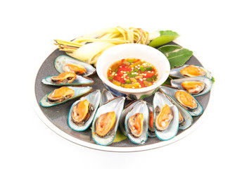 pile of cooked mussels over white background