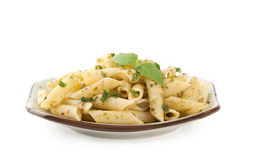 Pasta with pesto sauce on a plate