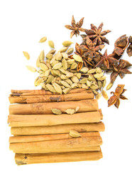 A group of cardamom, star anise, cloves and cinnamon spices.