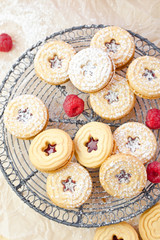 Jam-filled cookies and raspberries