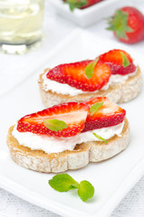 bruschetta with goat cheese, fresh strawberries, mint and honey
