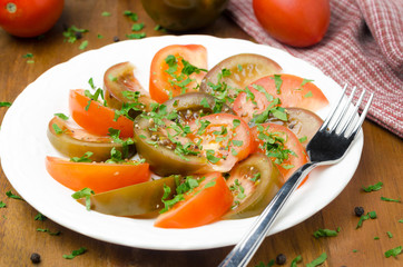salad of two varieties of tomatoes with fresh parsley horizontal