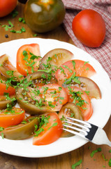salad of two varieties of tomatoes with parsley on the plate