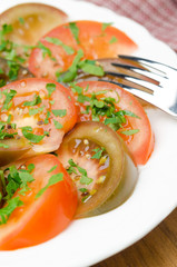 salad of two varieties of tomatoes with fresh parsley
