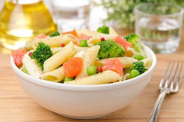 salad with pasta, smoked salmon, broccoli and green peas