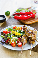 Grilled chicken skewer with salad
