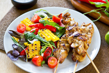 Grilled chicken skewer with salad