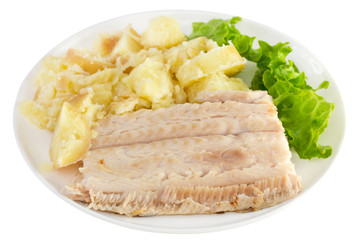 boiled fish with potato and lettuce on white plate
