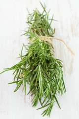 rosemary on white wooden desk