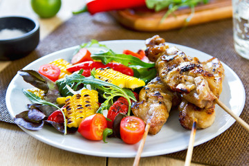 Grilled chicken skewer with salad